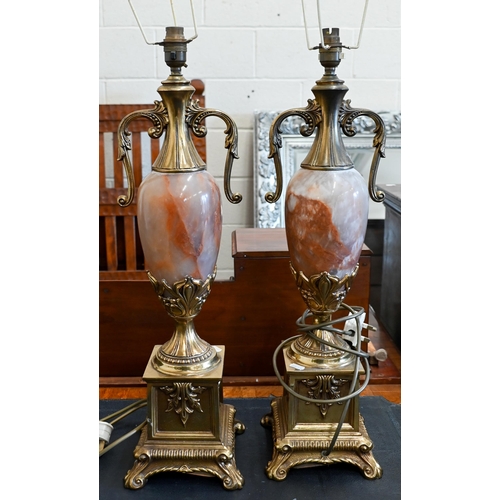 142 - A pair of large French Empire style onyx and brass table lamps, 65 cm high