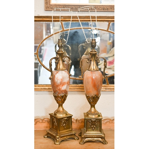 142 - A pair of large French Empire style onyx and brass table lamps, 65 cm high