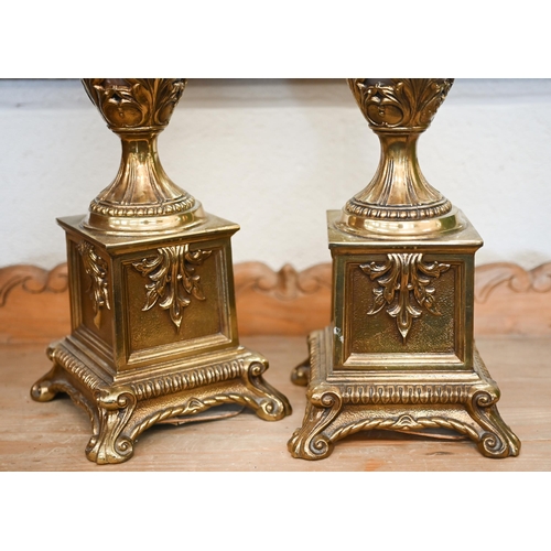 142 - A pair of large French Empire style onyx and brass table lamps, 65 cm high