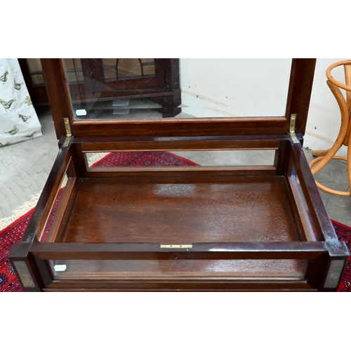 145 - A mahogany glazed vitrine on slender tapering supports, 60 x 40 x 74 cm high