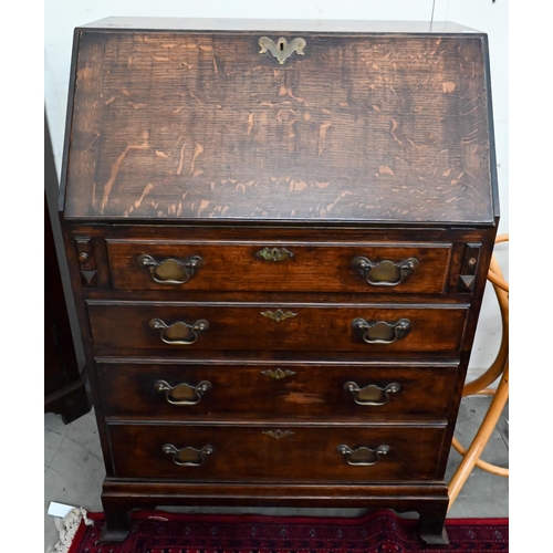 152 - #A small oak fall front bureau with four graduating drawers and shaped bracket feet, 70 cm wide x 44... 