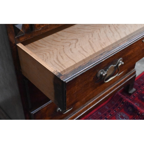 152 - #A small oak fall front bureau with four graduating drawers and shaped bracket feet, 70 cm wide x 44... 