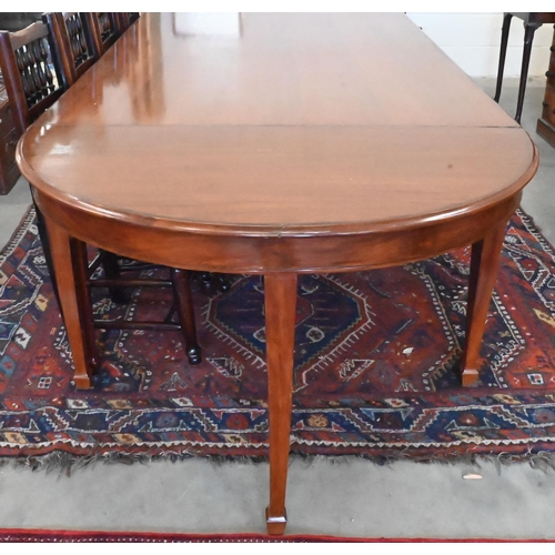 170 - A large hardwood dining table on square supports with spade feet and central rectangular section, 21... 