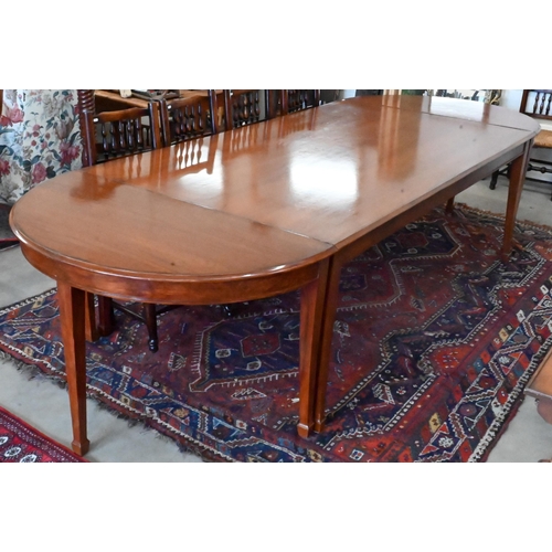 170 - A large hardwood dining table on square supports with spade feet and central rectangular section, 21... 