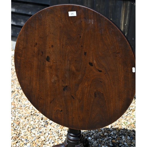 171 - A 19th century mahogany tilt-top table on gun barrel turned column and triform supports