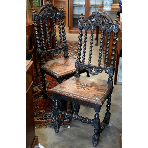 172 - A pair of late Victorian Gothic revival carved oak side chairs