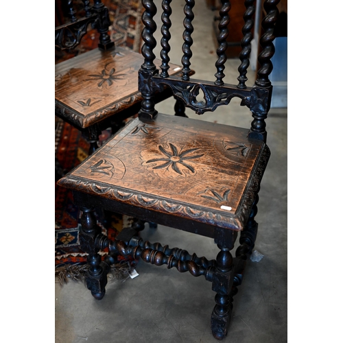 172 - A pair of late Victorian Gothic revival carved oak side chairs