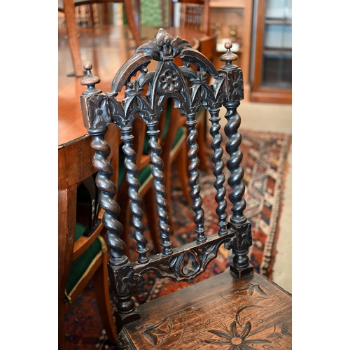 172 - A pair of late Victorian Gothic revival carved oak side chairs