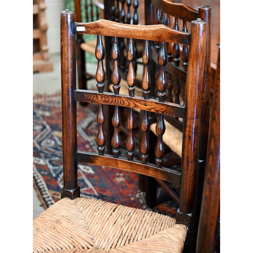 173 - A set of six turned spindle-back Lancashire elm and rush-seated dining chairs (6)