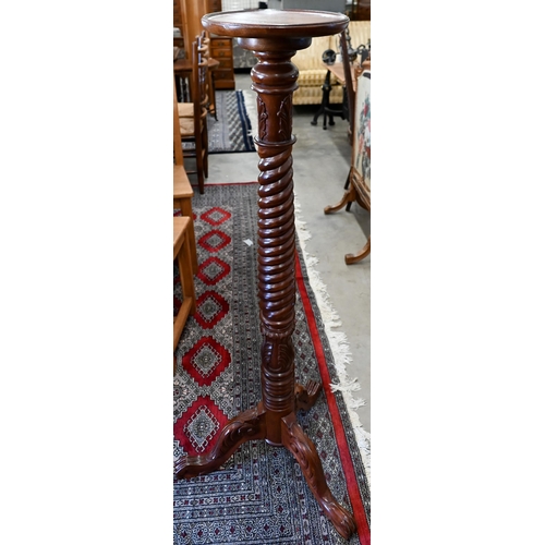 174 - A spiral turned and carved hardwood jardiniere stand, 130 cm high