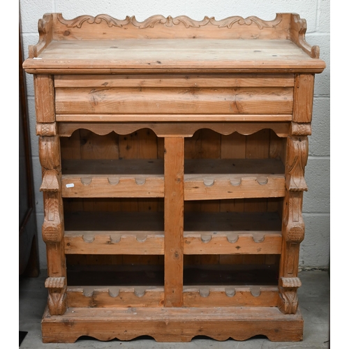 178 - A rustic French pine wine rack cabinet with cavetto drawer over open shelves, 84 x 38 x 100 cm high