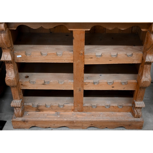 178 - A rustic French pine wine rack cabinet with cavetto drawer over open shelves, 84 x 38 x 100 cm high