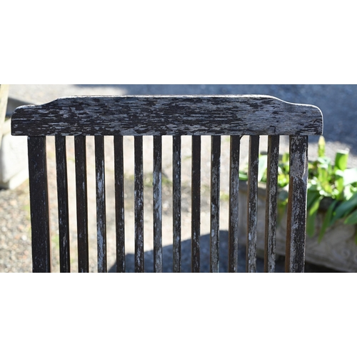 18 - A weathered octagonal garden table and four chairs, the table 100 cm diam, 69 cm high (5)