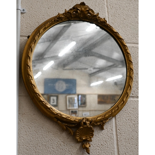 180 - An antique circular wall mirror in giltwood and gesso decorative frame, 50 x 42 cm