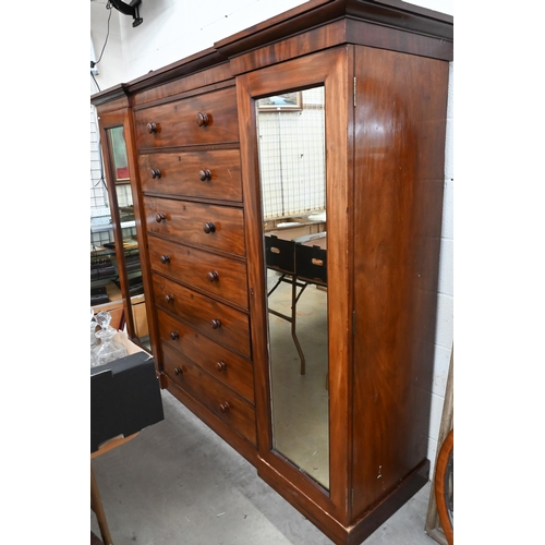 192 - A 19th century mahogany inverted breakfront compactum wardrobe with seven central drawers flanked by... 