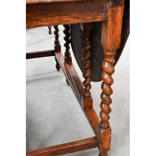 196 - #Oak drop leaf dining table on barley-twist gateleg action supports, 150 x 105 x 74 cm high