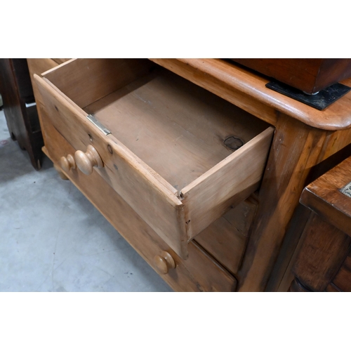 203 - A small stained pine chest of two short over two long drawers with turned handles and supports, 110 ... 