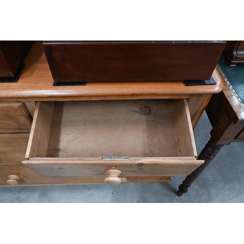 203 - A small stained pine chest of two short over two long drawers with turned handles and supports, 110 ... 