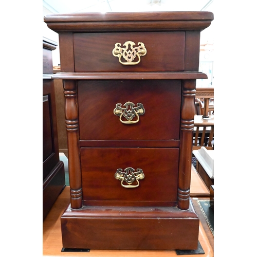 204 - A pair of stained hardwood three drawer bedside chests with turned half pillar mouldings, 40 x 40 x ... 