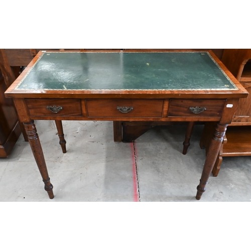 205 - A 19th century mahogany three drawer writing table with gilt tooled leather top and turned supports,... 