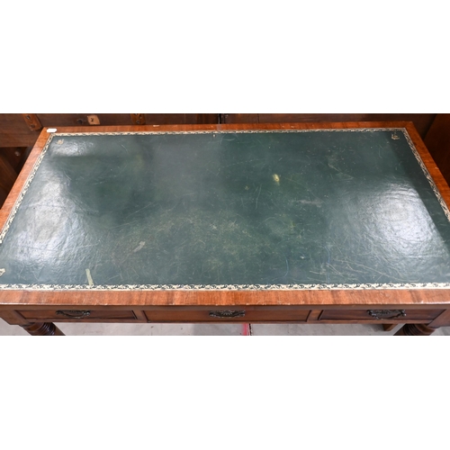 205 - A 19th century mahogany three drawer writing table with gilt tooled leather top and turned supports,... 