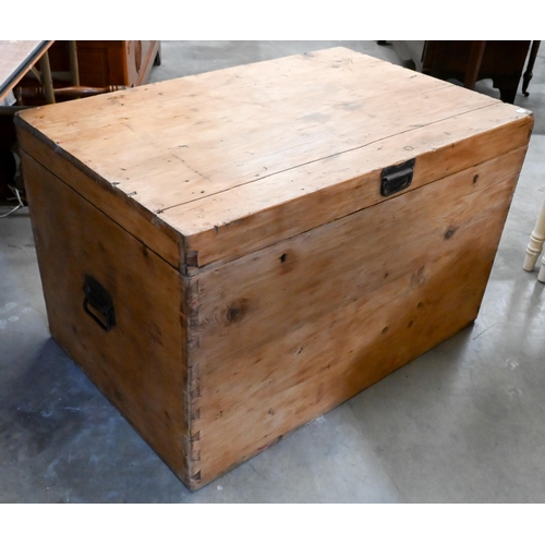 211 - An antique pine trunk with iron side handles, 92 x 60 x 58 cm high