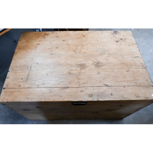 211 - An antique pine trunk with iron side handles, 92 x 60 x 58 cm high