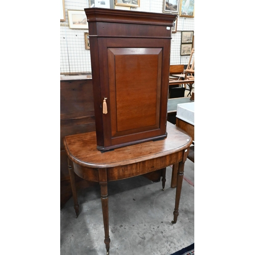 213 - A 19th century mahogany demi lune console table on turned supports and brass castors 88 x 52 x 70 cm... 