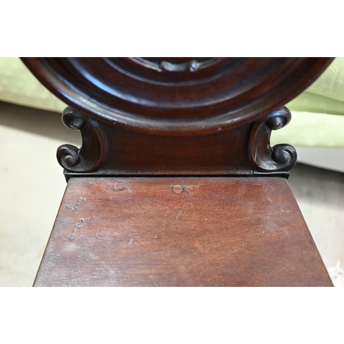 214 - A Victorian carved walnut balloon back side chair to/w a 19th century mahogany hall chair a/f (2)