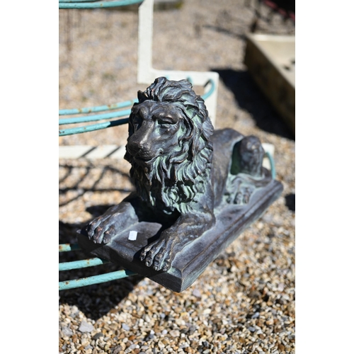 22 - A pair of Empire style bronzed composite recumbent lions, 40 cm long x 27 cm h (2)