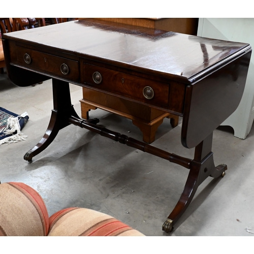 227 - A Regency mahogany sofa table with two drawers, rectangular supports with splayed legs terminating i... 