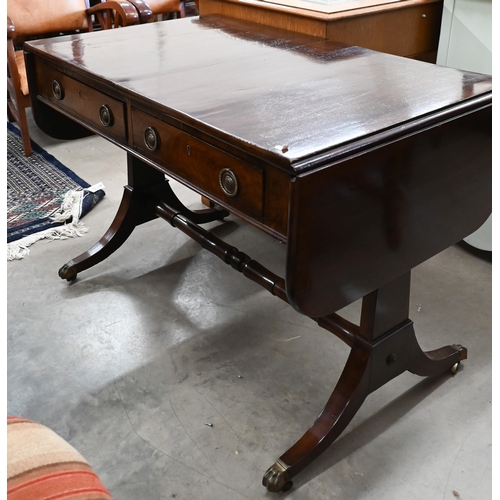 227 - A Regency mahogany sofa table with two drawers, rectangular supports with splayed legs terminating i... 