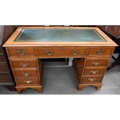 228 - A light oak veneered twin pedestal desk with gilt tooled green leather top, 122 x 60 x 76 cm high