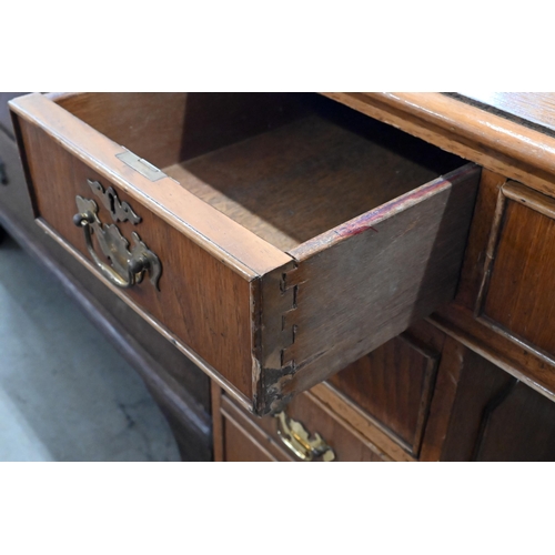 228 - A light oak veneered twin pedestal desk with gilt tooled green leather top, 122 x 60 x 76 cm high