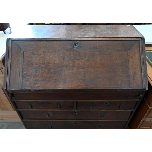 229 - #A Georgian oak fall front bureau with two short over two long drawers raised on bracket feet, 94 x ... 