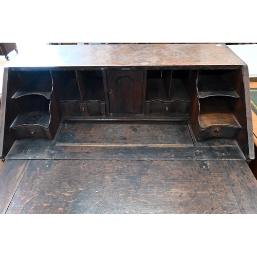 229 - #A Georgian oak fall front bureau with two short over two long drawers raised on bracket feet, 94 x ... 