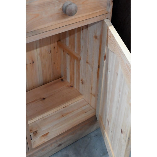 231 - A waxed pine side cabinet with two drawers over panelled cupboards, 92 x 42 x 86 cm high