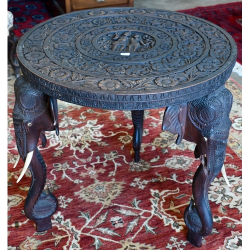 233 - An early 20th century carved hardwood Indian 'elephant' side table (A/F) 60 cm dia. x 62 cm high