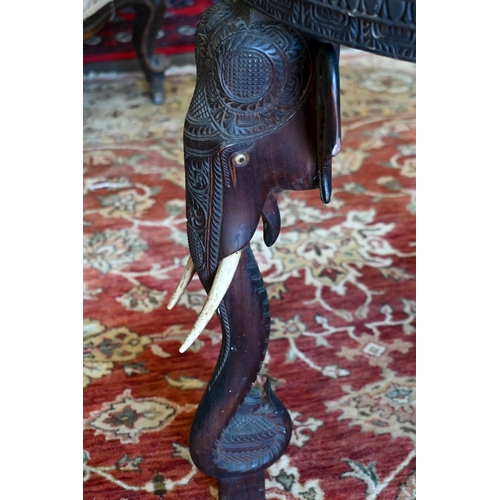 233 - An early 20th century carved hardwood Indian 'elephant' side table (A/F) 60 cm dia. x 62 cm high