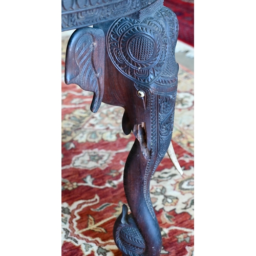 233 - An early 20th century carved hardwood Indian 'elephant' side table (A/F) 60 cm dia. x 62 cm high