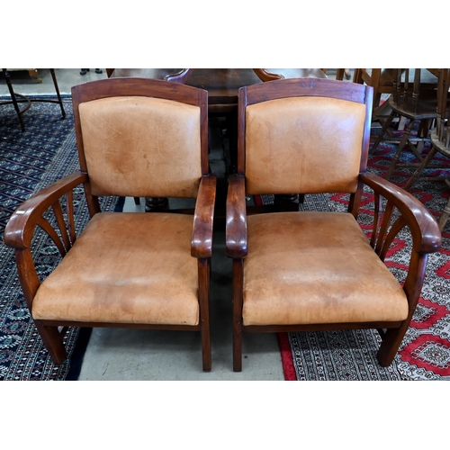 235 - A pair of stained hardwood and tan leather open armchairs in the Art-Deco manner