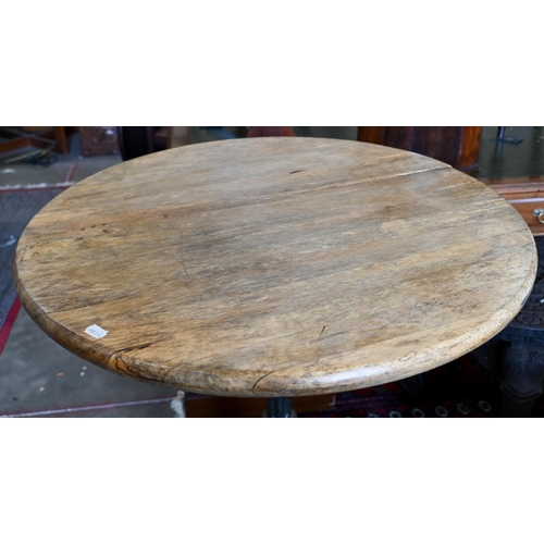 236 - A circular hardwood poseur bar/bistro table on ornate cast iron base, 68 cm dia. x 110 cm high