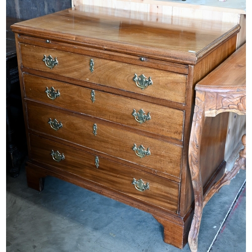 242 - A George III mahogany chest of  four long drawers below a full width brushing slide, raised on brack... 