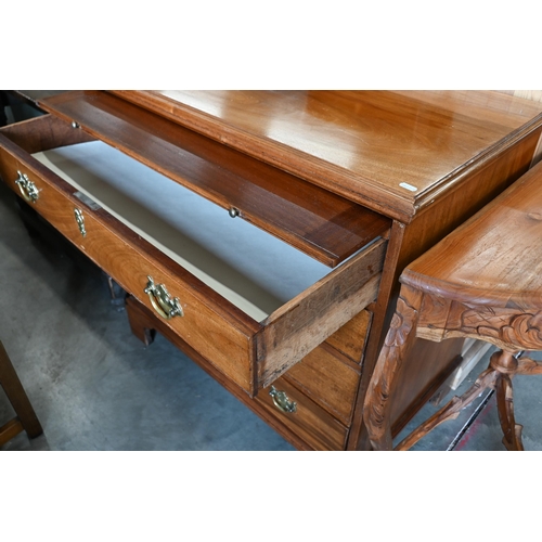 242 - A George III mahogany chest of  four long drawers below a full width brushing slide, raised on brack... 