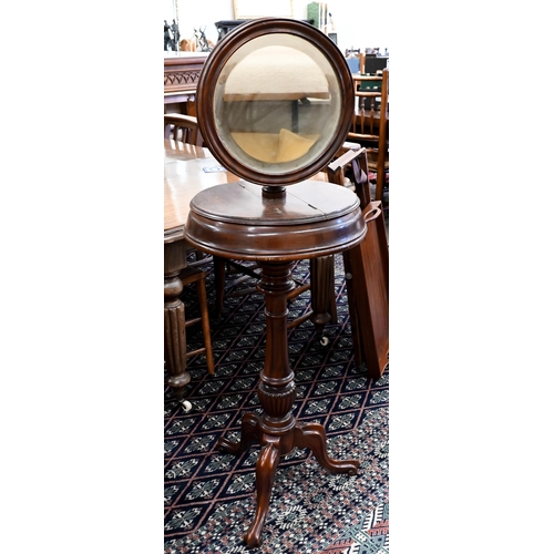 245 - A Victorian mahogany shaving/vanity stand with twin hinged storage compartments, adjustable mirror a... 