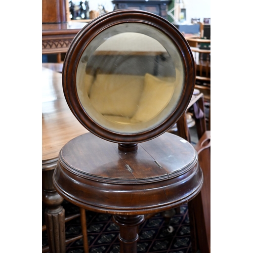 245 - A Victorian mahogany shaving/vanity stand with twin hinged storage compartments, adjustable mirror a... 