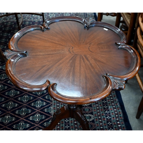 246 - A mahogany butterfly design side table with lobed top on tripod base, 60 cm dia. x 70 cm h