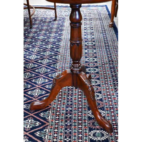 246 - A mahogany butterfly design side table with lobed top on tripod base, 60 cm dia. x 70 cm h