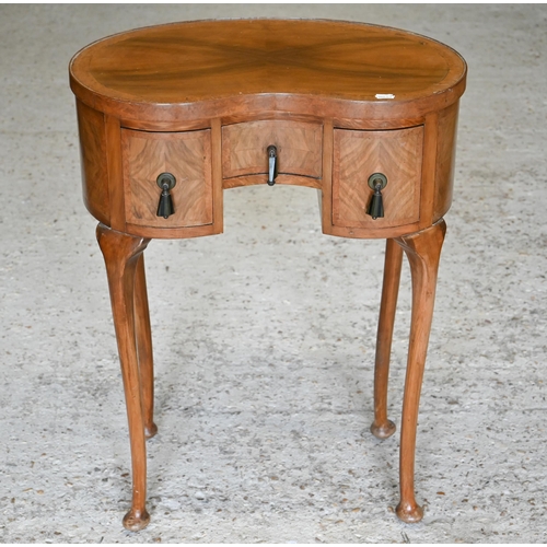 251 - Edwardian walnut kidney shaped side table with three drawers, on pad footed cabriole supports, 52 cm... 