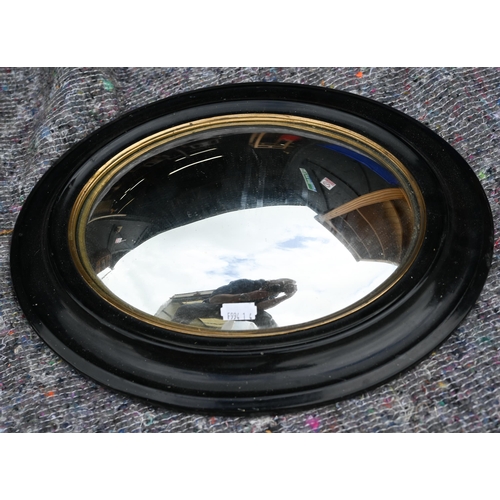 256 - An oval convex wall mirror in moulded ebonised frame, 40 x 30 cm, to/w three various oval gilt frame... 